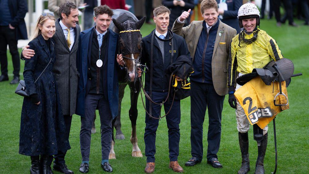 Trainer James Owen (second from right) gives the thumbs-up after Burdett Road's win at Cheltenham