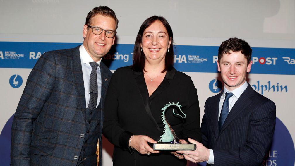 Ed Chamberlin (left) and Oisin Murphy present Simone Sear with the Rory MacDonald Award at the awards in February 2020