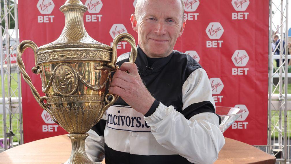 Joe Fanning lifts up the Ayr Gold Cup trophy on Saturday