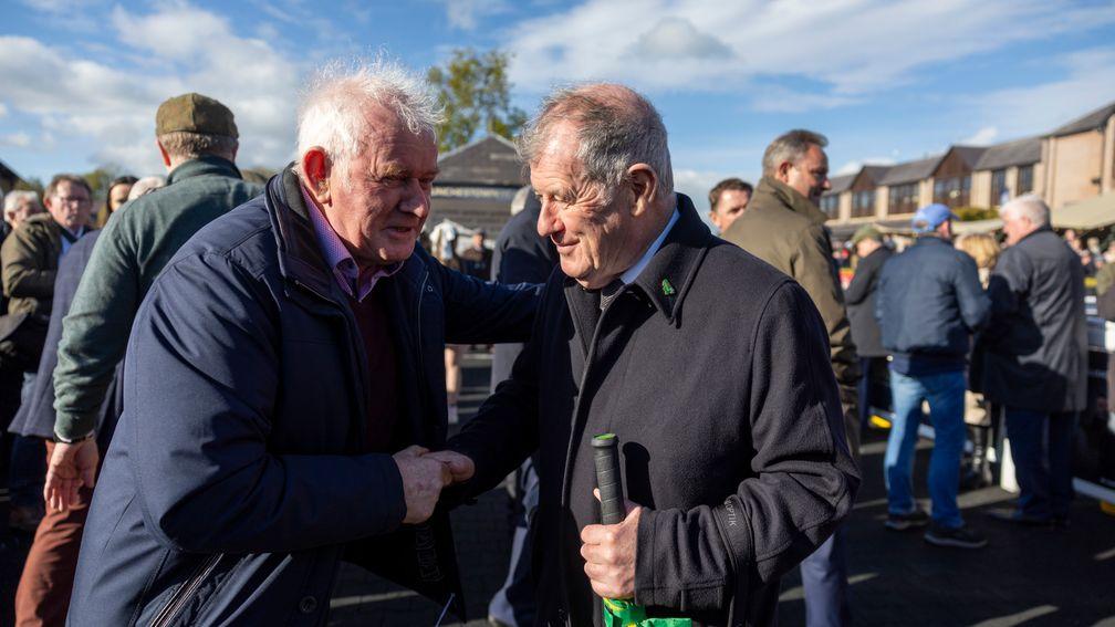 Jimmy Mangan (left) is congratulated by JP McManus after Spillane's Tower's victory in the Champion Novice Chase at Punchestown