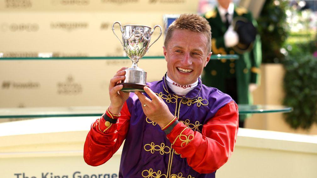 Tom Marquand poses with the trophy after winning the King George V Stakes on Desert Hero