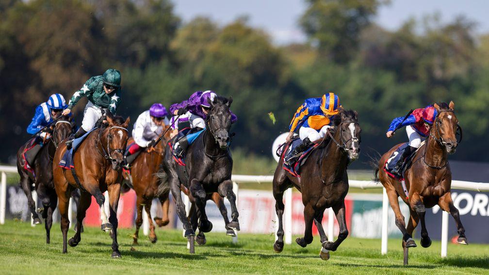 Auguste Rodin (second right) stays on best to land the Irish Champion Stakes