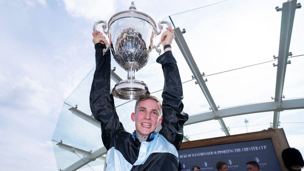Harry Davies holds the Chester Cup aloft after winning the 200th running on Zoffee