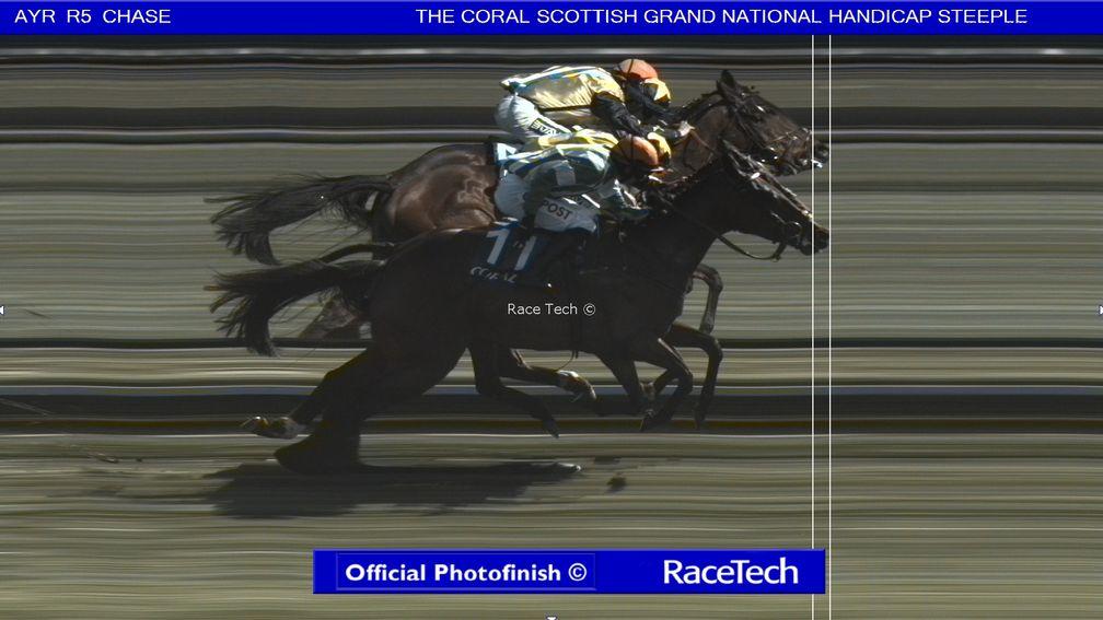 Macdermott (near side) holds off Surrey Quest to win the Scottish Grand National