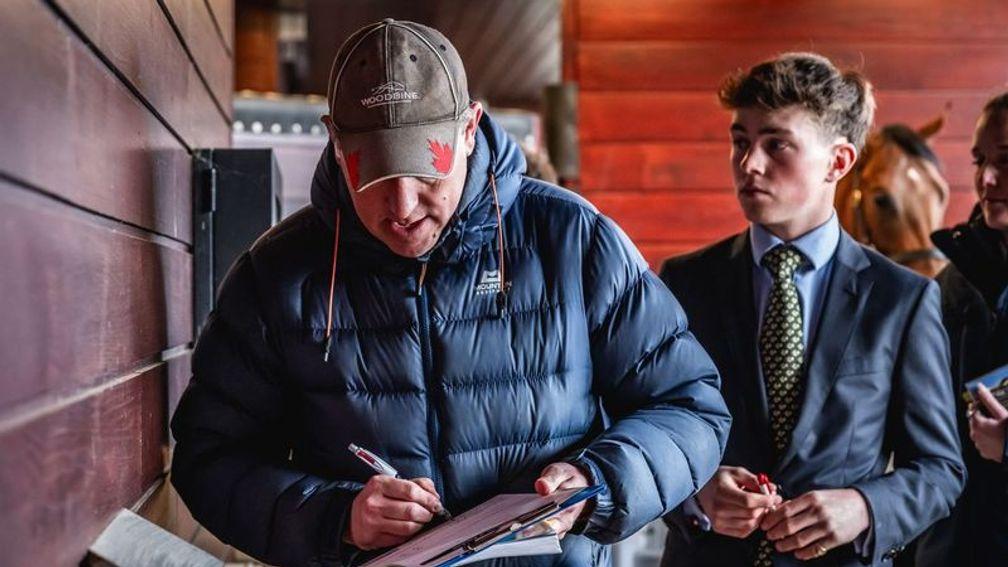 Richard Brown of Blandford Bloodstock signs the docket for Tally-Ho Stud's Mehmas half-brother to Marshman at the Goffs Doncaster Breeze-Up Sale