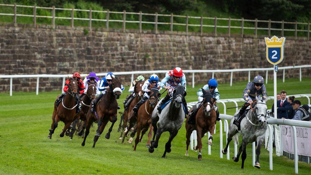 Restorer leads at the two furlong mark before stretching clear to win at Chester