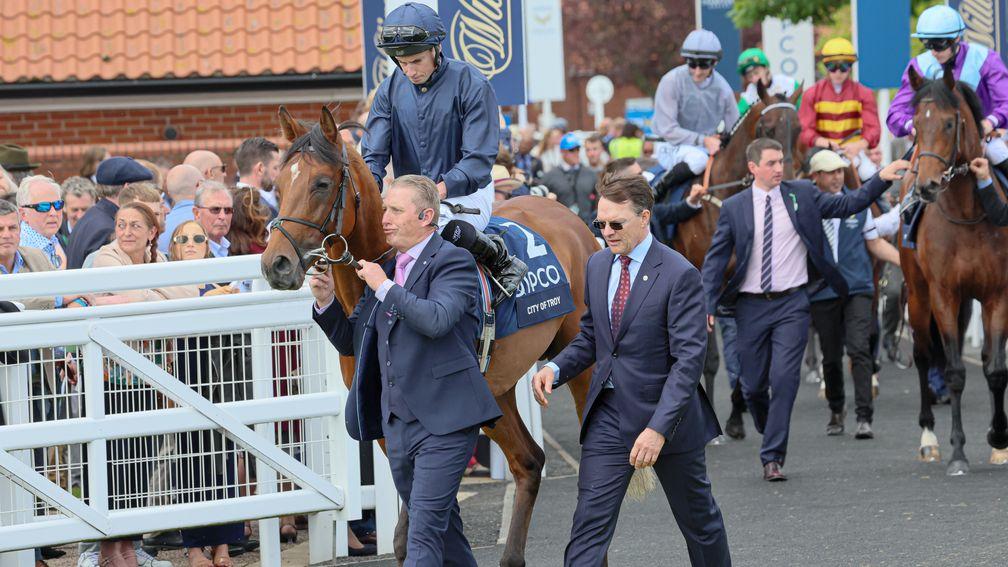 City Of Troy emerges on to the racecourse alongside Aidan O'Brien before disappointing in the 2,000 Guineas