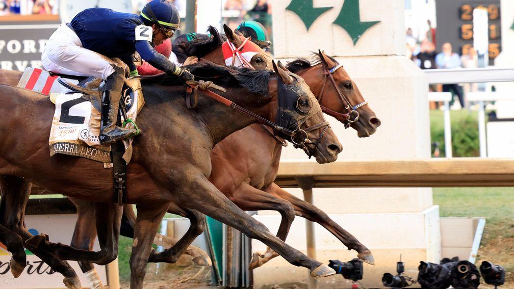 Mystik Dan (far side) crosses the finish line to win the 150th running of the Kentucky Derby at Churchill Downs