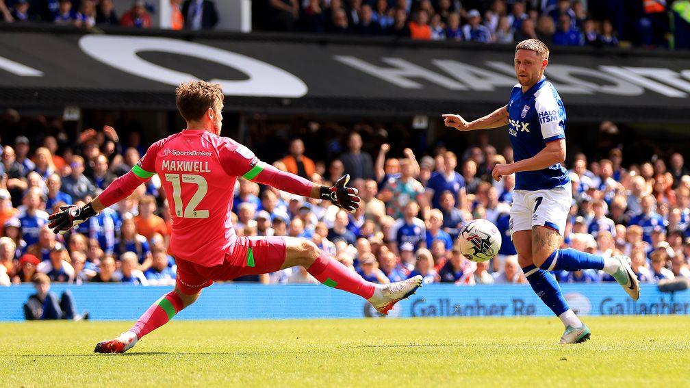 Wes Burns helped Ipswich seal promotion with a win over Huddersfield