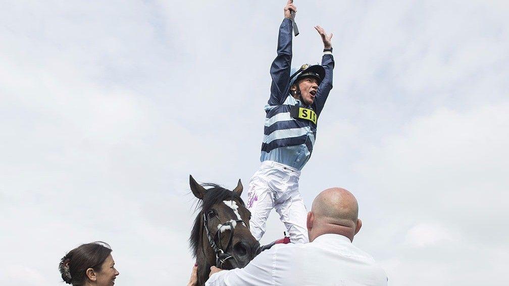 Frankie Dettori performs a flying dismount following Western Hymn win in the Ormonde Stakes