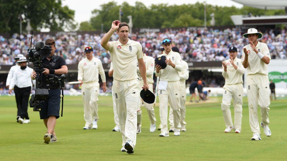 Chris Woakes leads England off after his six-wicket burst against Ireland at Lord's