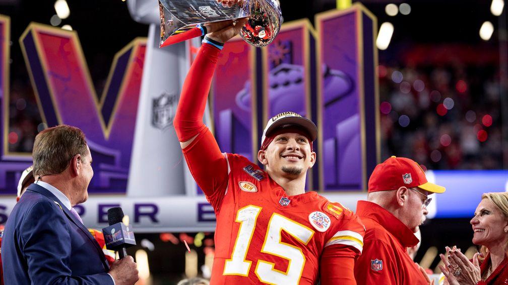 Patrick Mahomes of the Kansas City Chiefs celebrates with the Vince Lombardi Trophy following NFL Super Bowl 58 (Photo by Michael Owens/Getty Images)