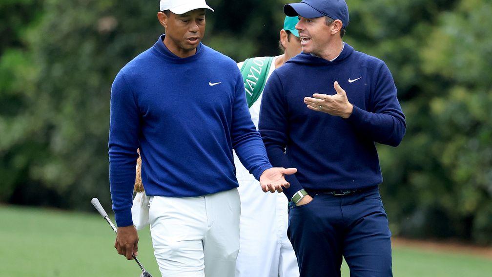 Rory McIlroy (right) could be about to follow Tiger Woods (left) into the Grand Slam club