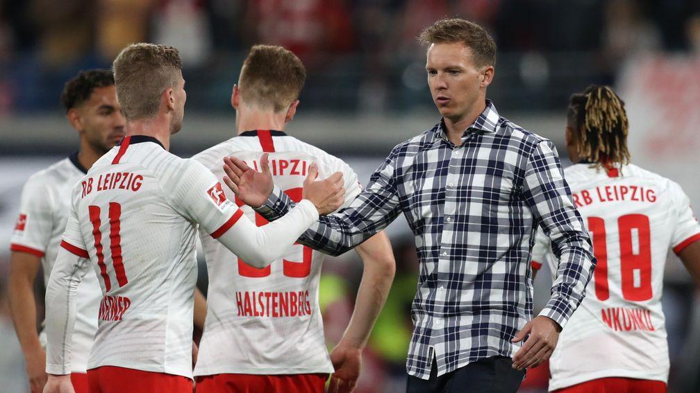 Timo Werner shakes hands with RB Leipzig and Head Coach Julian Nagelsmann
