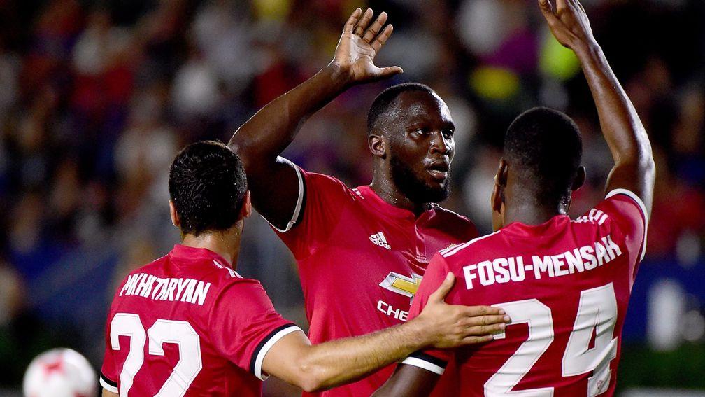 Romelu Lukaku celebrates with his new Manchester United teammates during preseason