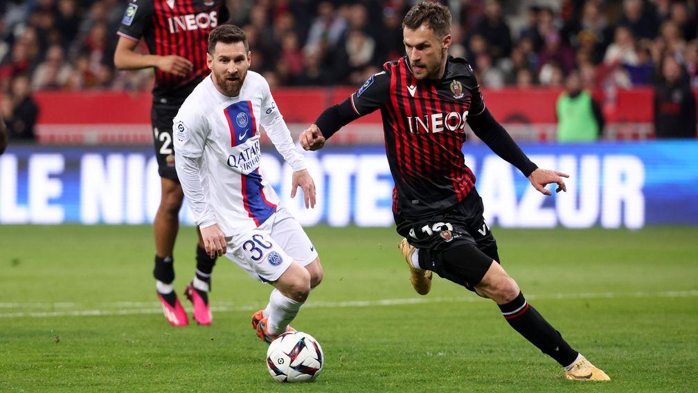 Nice midfielder Aaron Ramsey in action against PSG and Lionel Messi