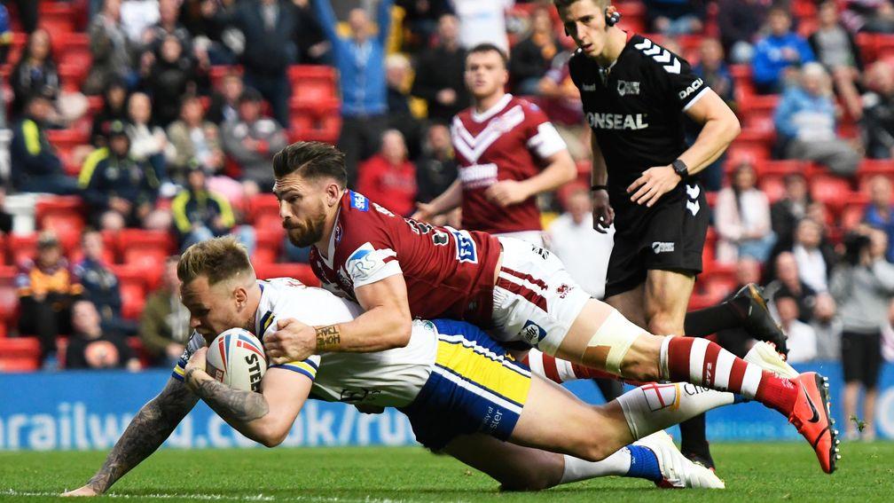 Warrington's Blake Austin scores a try against Wigan at Anfield