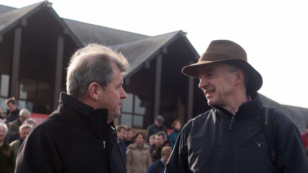 Owners JP McManus and Michael O'Leary share a word at Punchestown