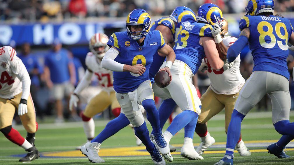 Rams quarterback Matthew Stafford hands the ball off in the Week 18 game with the 49ers