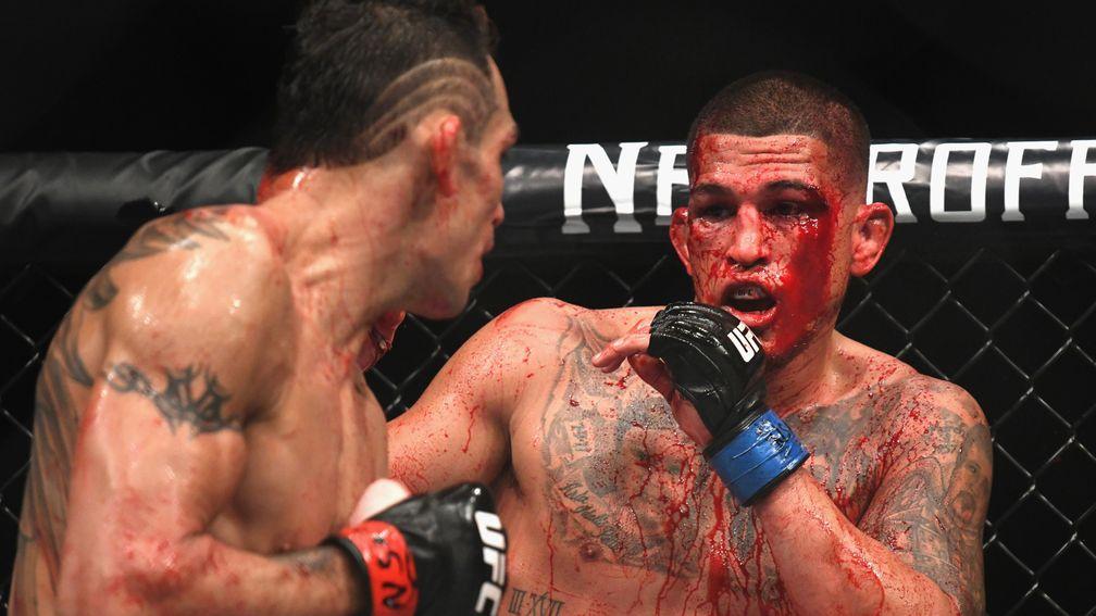 A blood-splattered Anthony Pettis watches Tony Ferguson during UFC 229