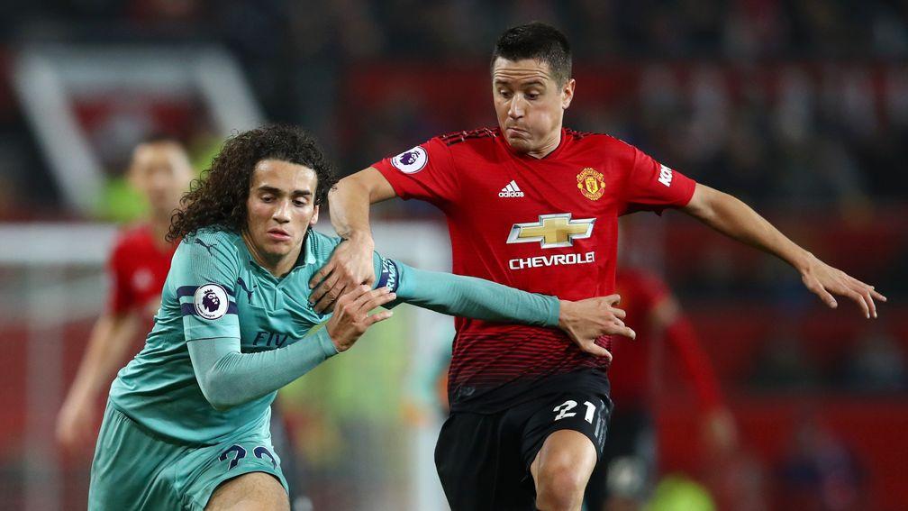 Arsenal's Matteo Guendouzi (left) and Ander Herrera of Manchester United (right) tussling in their Premier League clash at Old Trafford