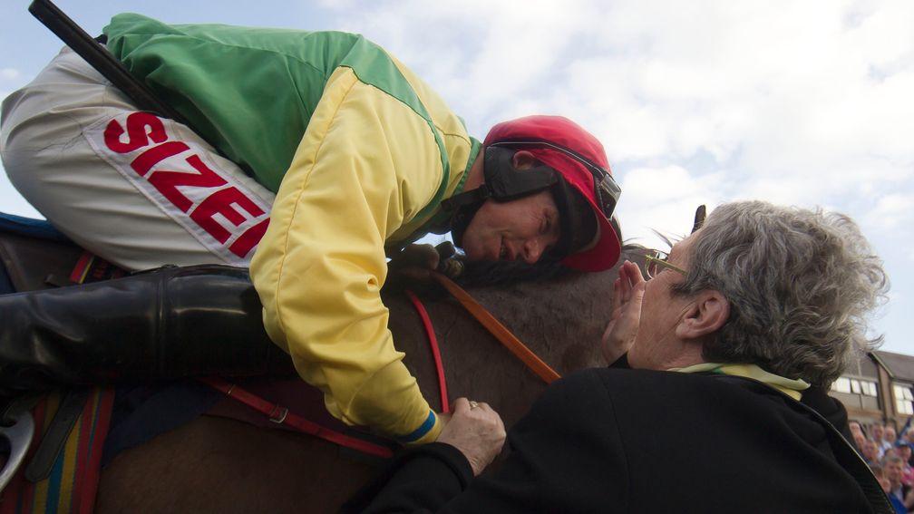 Andrew Lynch celebrates with the late Ann Potts after winning aboard Sizing Europe at the 2014 Punchestown festival