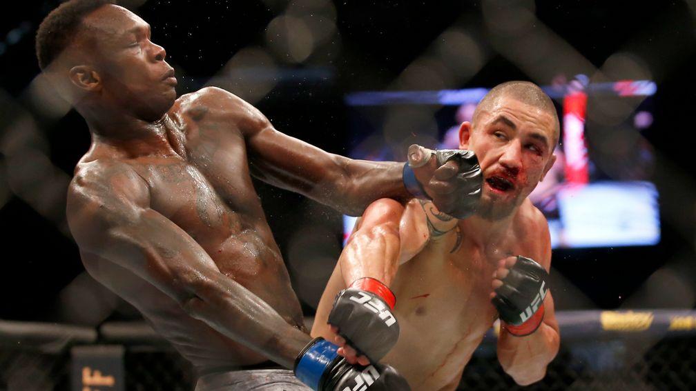 Robert Whittaker (right) bids to atone for his 2019 defeat against Israel Adesanya