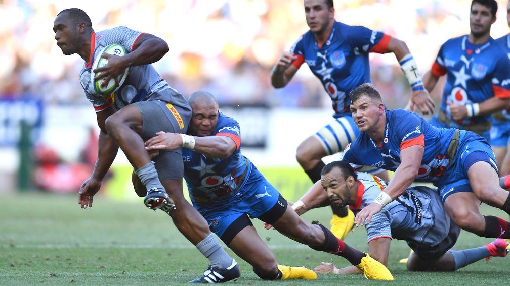 Stormers flyer Sergeal Petersen is tackled by Cornal Hendricks of the Bulls