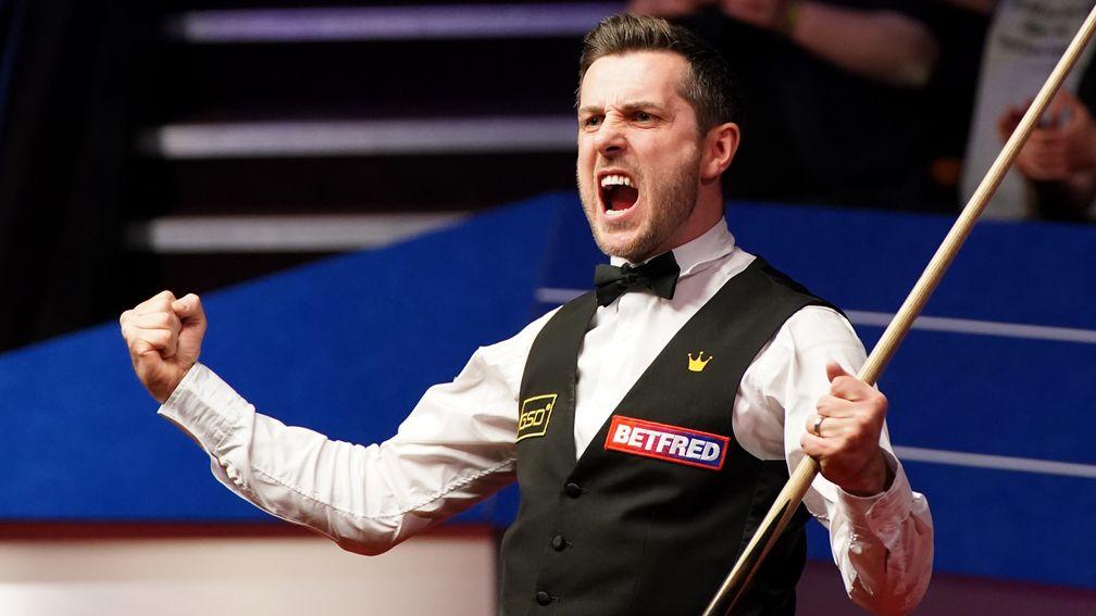 Mark Selby celebrates after clinching his fourth Crucible crown