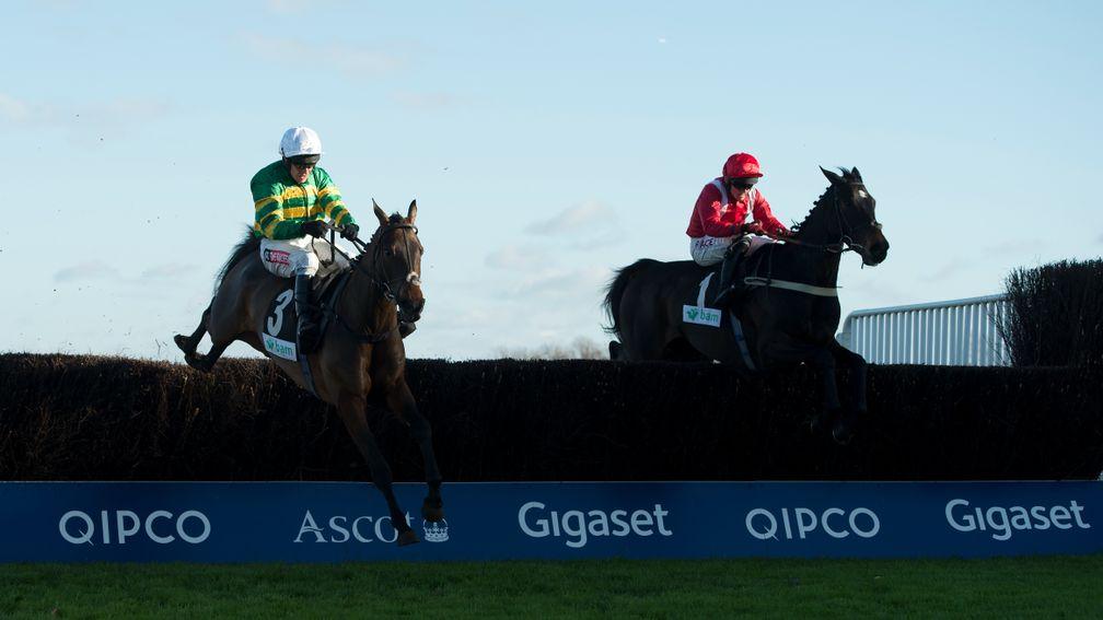 Another Hero (Barry Geraghty,left) jumps the last fence and wins the 3m novice handicap chase from Delgany DemonAscot 21.11.15 Pic: Edward Whitaker