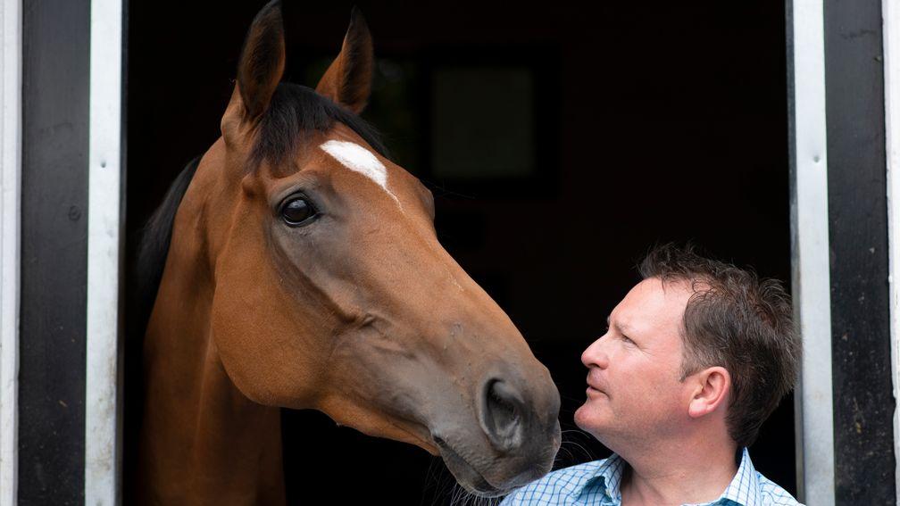 Ed Vaughan stands with stable star Dame Malliot