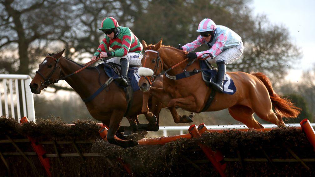 WETHERBY, ENGLAND - MARCH 08: Pay The Piper ridden by Danny McMenamin (L) clears a fence on their way to winning the Join Racing TV Now Handicap Hurdle on March 8, 2021 in Wetherby, England. (Photo by Tim Goode - Pool/Getty Images)