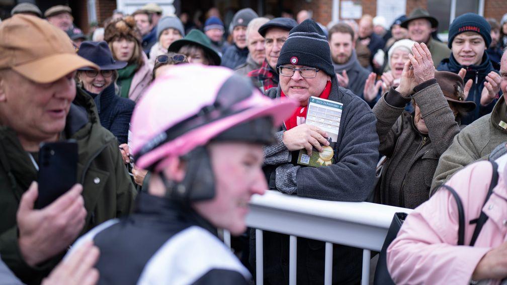 Racegoers flock to the winner's enclosure at Plumpton to welcome back Joe Anderson
