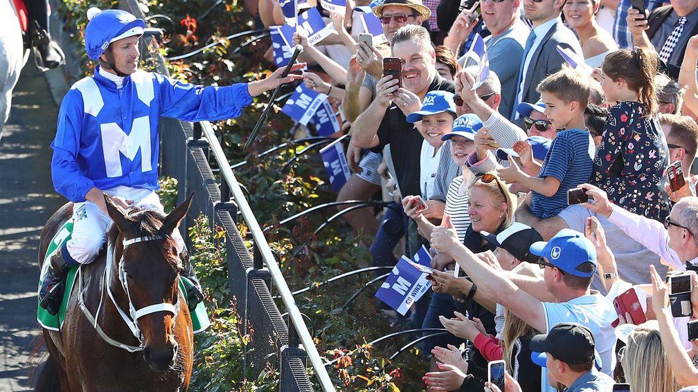 Hugh Bowman salutes Winx’s adoring fans at Flemington after last year’s Turnbull Stakes victory
