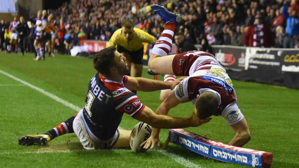 Liam Marshall of Wigan Warriors touches down to score a try