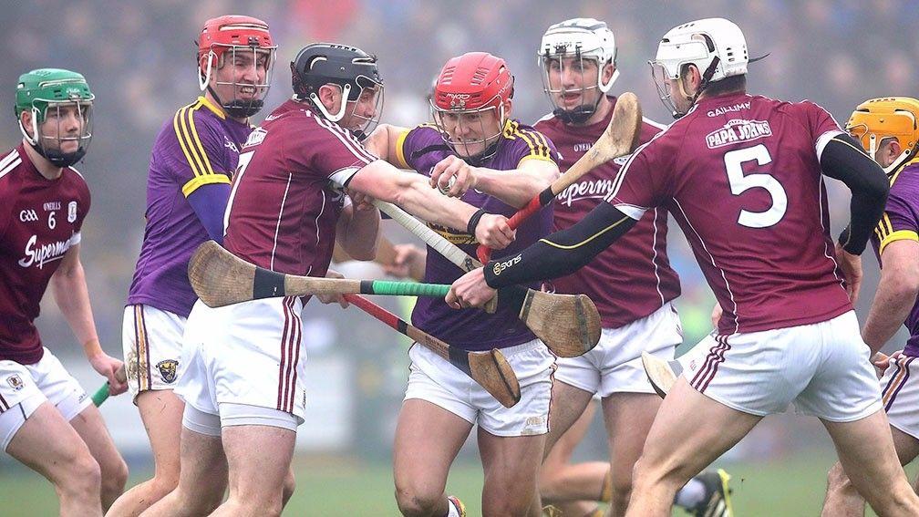 Galway's Aidan Harte and Geroid McInerney battle with Wexford's Lee Chin