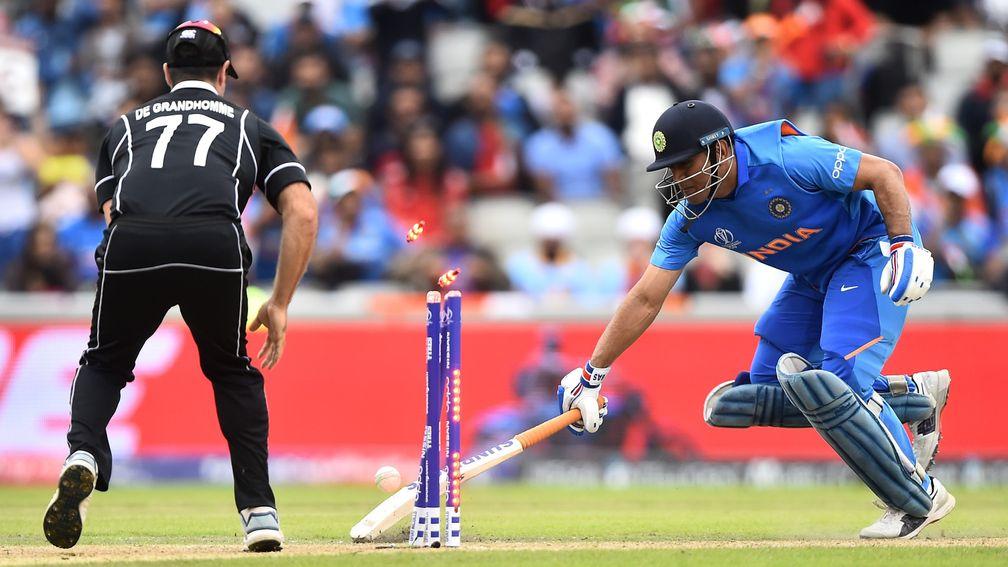 MS Dhoni is run out by Martin Guptill's throw as India slipped to defeat