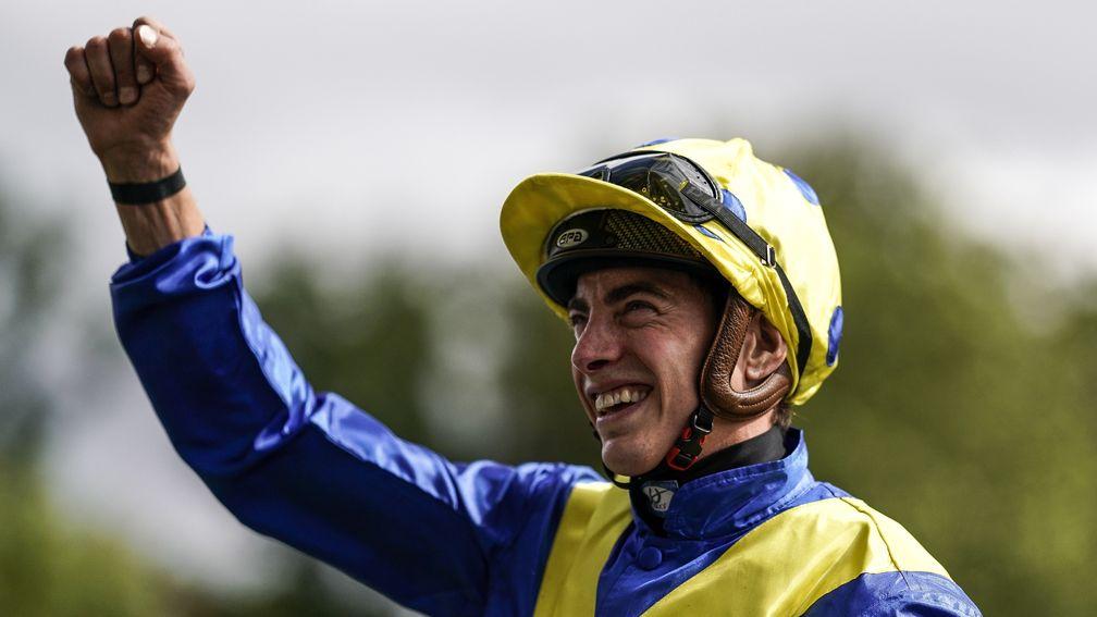 James Doyle celebrates victory after riding Poet's Word to win the King George at Ascot