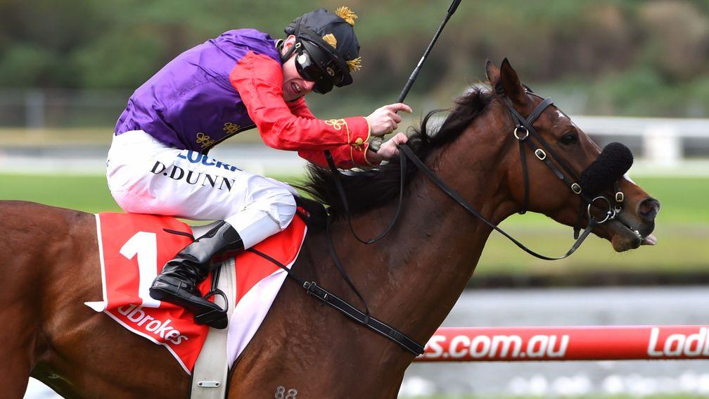 Dylan Dunn riding Bold Sniper to victory in the Queen's colours
