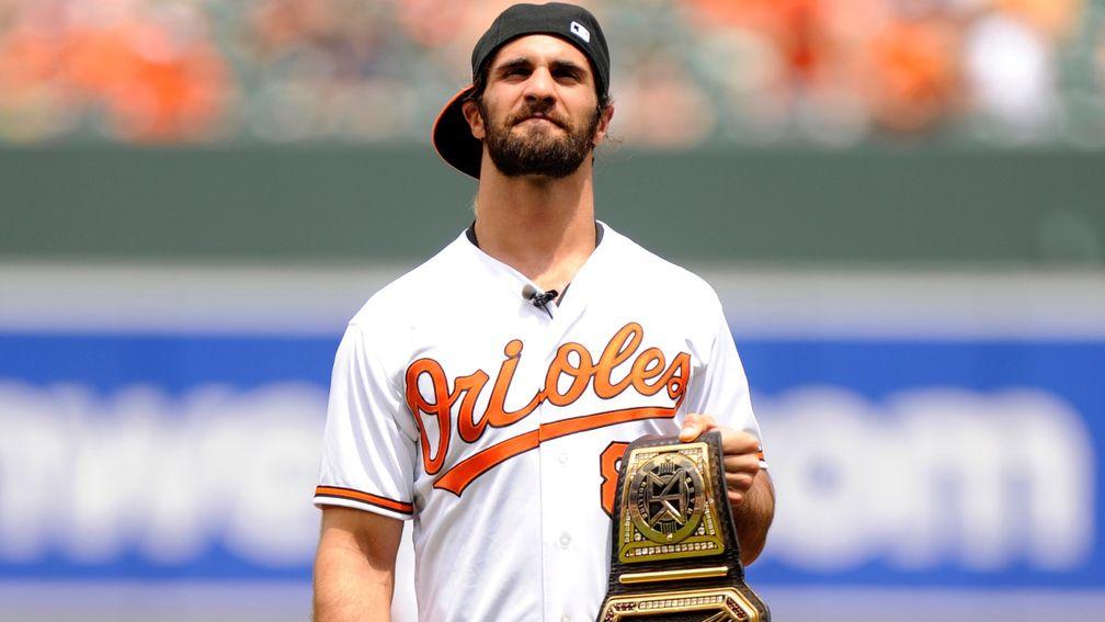 WWE World Heavyweight Champion Seth Rollins before throwing out the first pitch at a baseball game