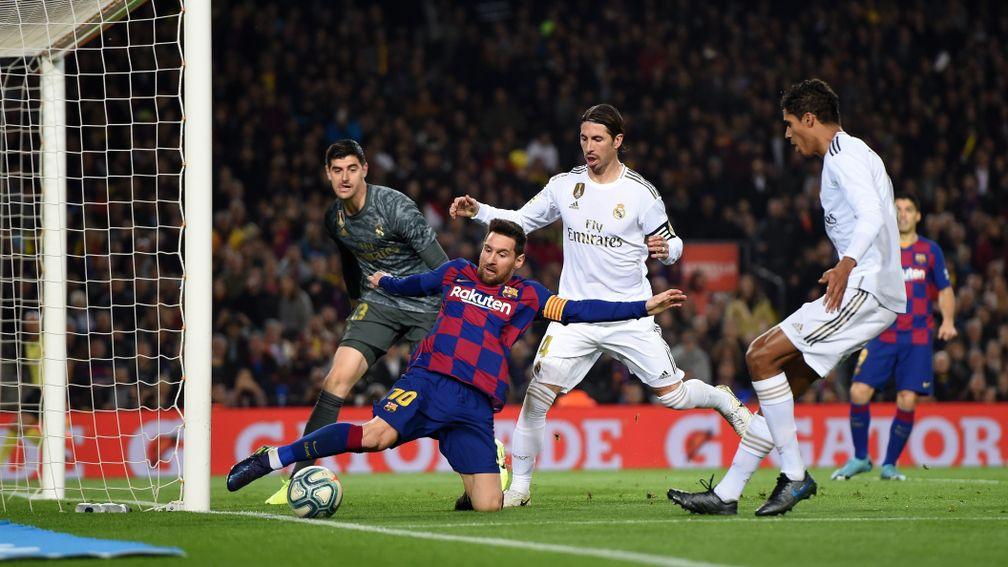 Real Madrid fight to keep Barcelona's Lionel Messi at bay