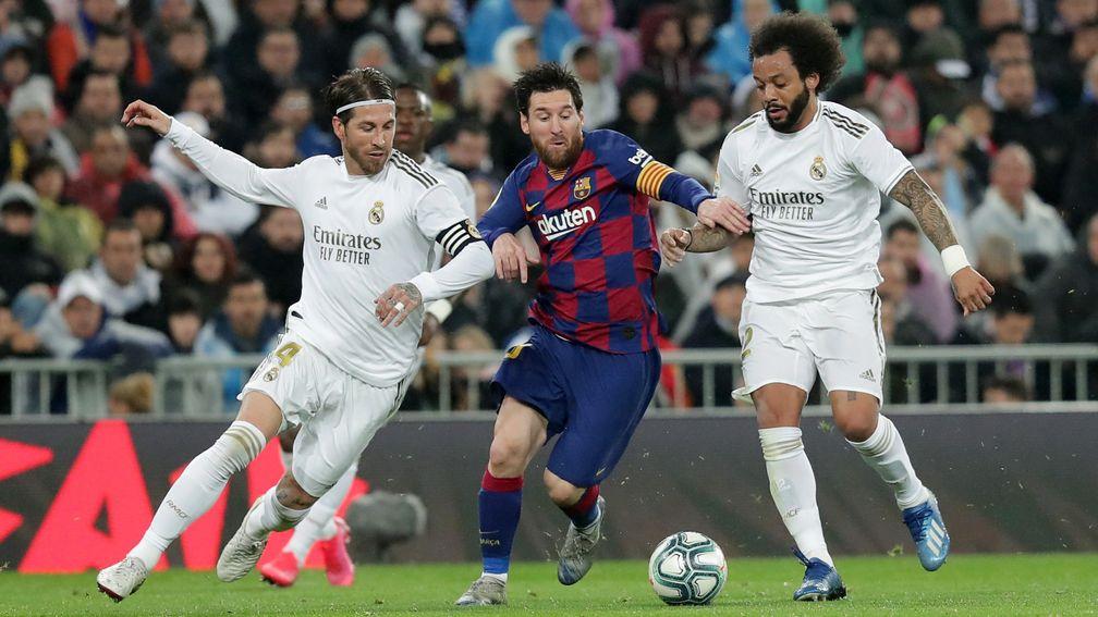 Lionel Messi of Barcelona is challenged by Real Madrid's Sergio Ramos  (left) and Marcelo in March's La Liga clash