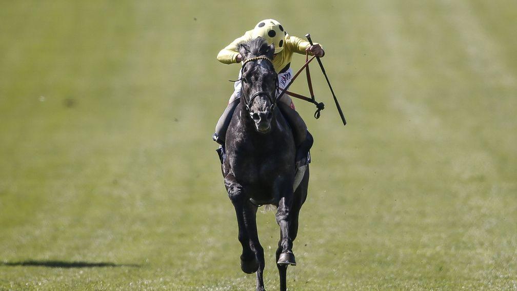 Defoe gallops on powerfully to win the Jockey Club Stakes
