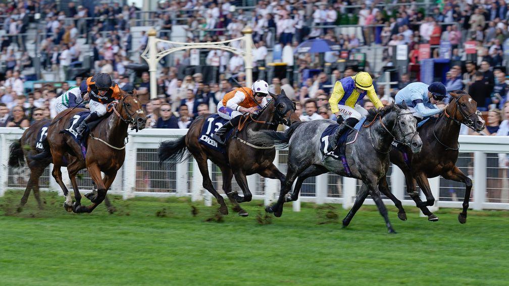 Harry Davies riding Atrium (right) win the Howden Challenge Cup from Tom Marquand and Popmaster at Ascot