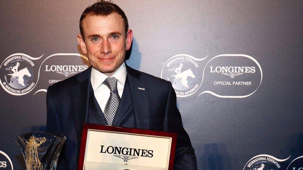 Ryan Moore poses with his trophy after being crowned Longines World's Best Jockey