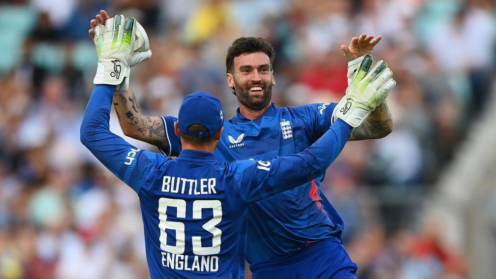 England's Jos Buttler and Reece Topley celebrate a wicket in the ODI series win over New Zealand