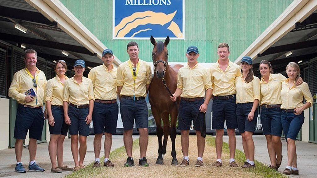The Segenhoe Stud team pose with the session-topping Redoute's Choice colt outside the Gold Coast sales ring