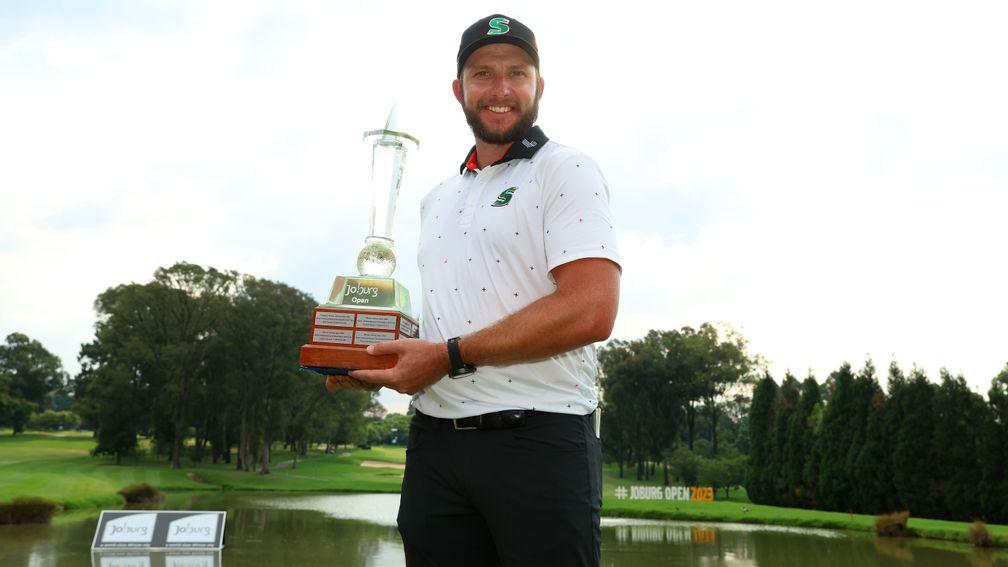 Dean Burmester parades the Joburg Open trophy after his convincing triumph on Sunday