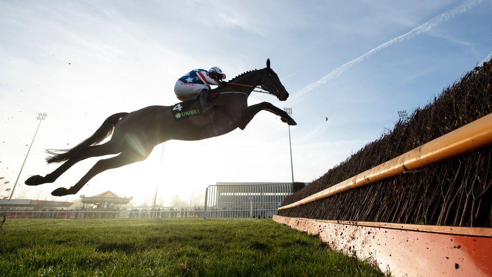 Special Tiara puts in a spectacular leap at the third fence of Kempton's Desert Orchid Chase last December