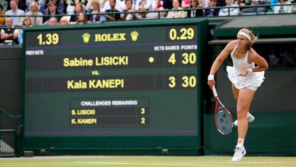 Sabine Lisicki serves at Wimbledon